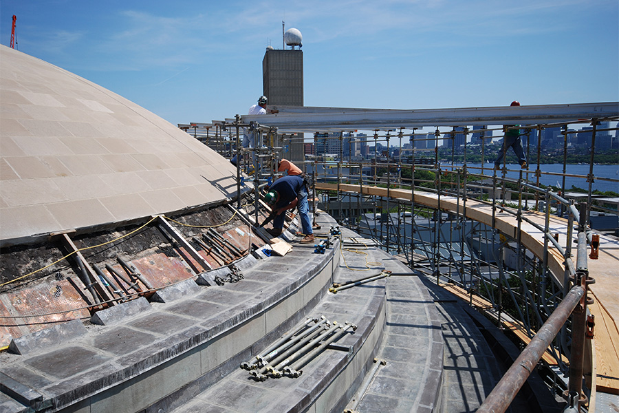 Photo of construction workers on MIT dome
